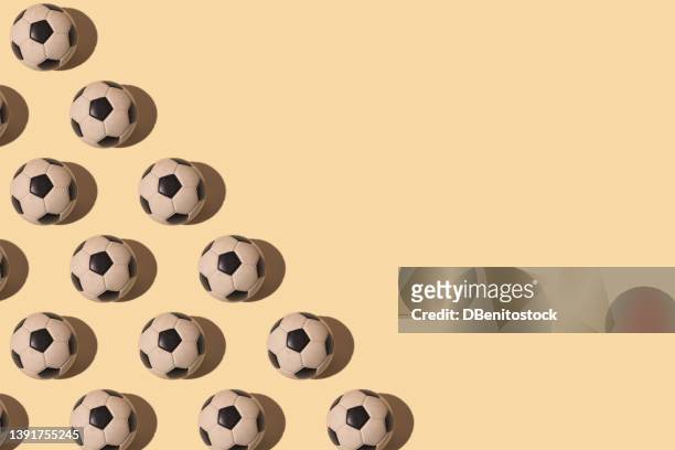 retro soccer balls pattern with hard shadow, on the left side, on pastel background. concept of soccer world cup, sport, competition and world champion. - international soccer event stock pictures, royalty-free photos & images
