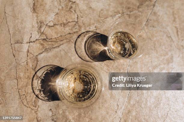 plastic glasses with white wine. - water glass top view stock pictures, royalty-free photos & images