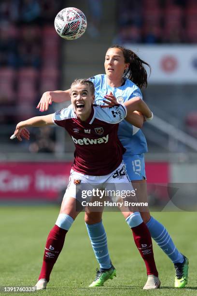 Dagny Brynjarsdottir of West Ham United is challenged by Caroline Weir of Manchester City during The Vitality Women's FA Cup Semi-Final match between...