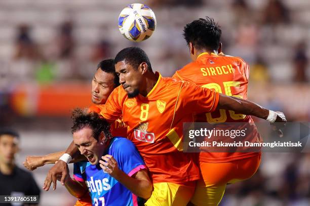 Raul Baena of Kitchee SC competes for a header against Getterson dos Santos and Siroch Chatthong of Chiangrai United during the first half of the AFC...