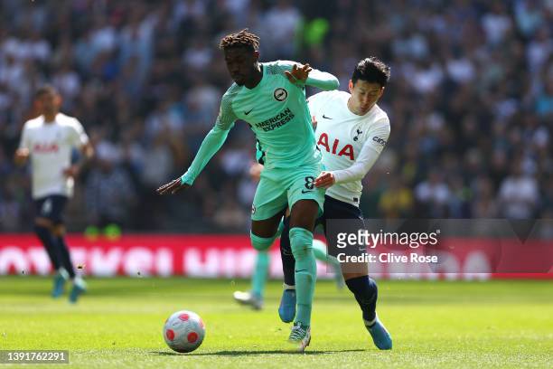 Yves Bissouma of Brighton & Hove Albion is challenged by Heung-Min Son of Tottenham Hotspur during the Premier League match between Tottenham Hotspur...
