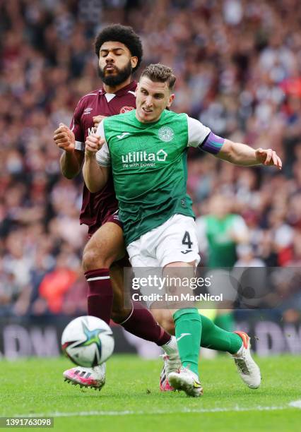 Paul Hanlon of Hibernian FC battles for possession with Ellis Simms of Heart of Midlothian during the Scottish Cup Semi Final match between Heart Of...