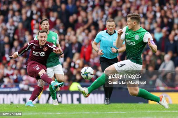 Barrie McKay of Heart of Midlothian shoots and has his shot blocked by Paul Hanlon of Hibernian FC during the Scottish Cup Semi Final match between...