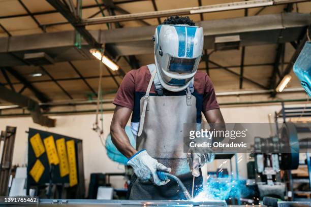 afro american welder - welding mask stock pictures, royalty-free photos & images