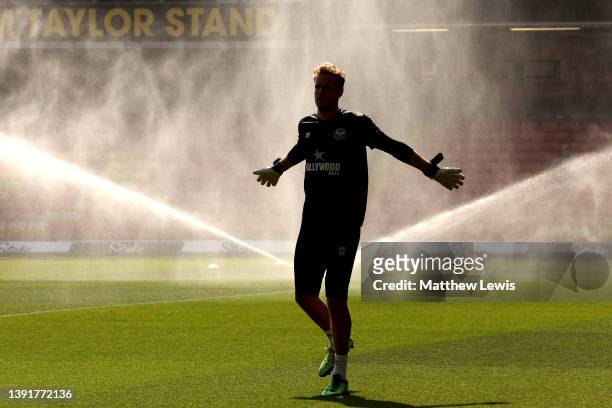 Jonas Lossl of Brentford warms up prior to the Premier League match between Watford and Brentford at Vicarage Road on April 16, 2022 in Watford,...