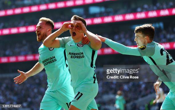 Leandro Trossard of Brighton & Hove Albion celebrates with team mates Alexis Mac Allister and Solly March after scoring their sides first goal during...