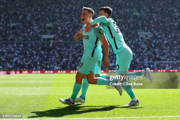 Leandro Trossard of Brighton & Hove Albion celebrates with team mates Alexis Mac Allister and Solly March after scoring their sides first goal during...