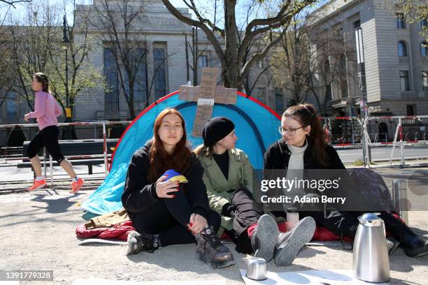 Russian activists Polina Oleinikova, Polina Kviatkovskaia and Elena Malysheva participate in a hunger strike outside the Russian embassy against that...