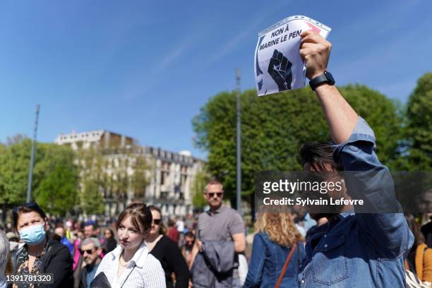 Demonstrator holds a panel reading "No to Marine Le Pen" during a gathering against far-right candidate for the second round of french presidential...