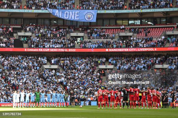 Both teams, fans and officials stand for a minute silence in memory of those who died during the Hillsborough disaster prior to The Emirates FA Cup...