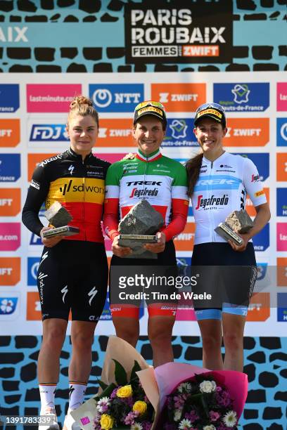 Lotte Kopecky of Belgium and Team SD Worx on second place, race winner Elisa Longo Borghini of Italy and Team Trek - Segafredo holds up her...