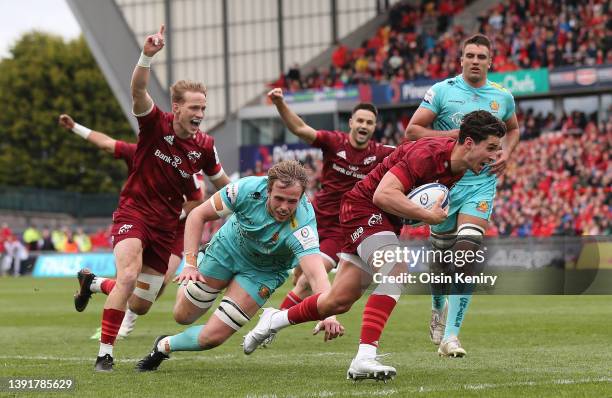 Joey Carbery of Munster on his way to scoring their sides first try during the Heineken Champions Cup Round of 16 Leg Two match between Munster Rugby...