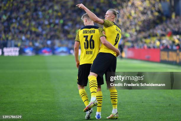 Erling Haaland of Borussia Dortmand celebrates scoring their side's sixth goal with teammate Tom Rothe during the Bundesliga match between Borussia...