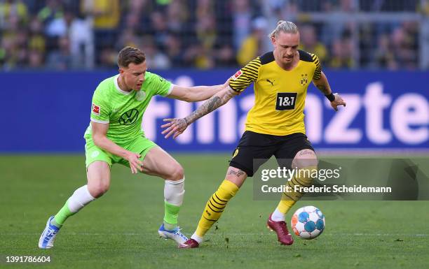 Yannick Gerhardt of VfL Wolfsburg marks Erling Haaland of Borussia Dortmand during the Bundesliga match between Borussia Dortmund and VfL Wolfsburg...