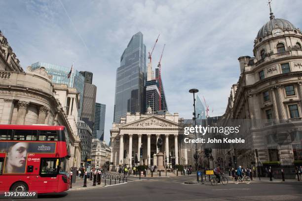 General view of a red double decker buss at the Royal Exchange by the Bank of England at Bank with commercial skyscrapers Tower 42 , 22 Bishopsgate,...