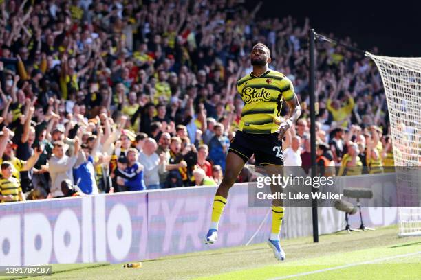 Emmanuel Dennis of Watford FC celebrates after scoring their team's first goal during the Premier League match between Watford and Brentford at...