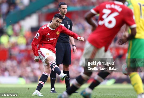 Cristiano Ronaldo of Manchester United scores their sides third goal and their hat-trick during the Premier League match between Manchester United...