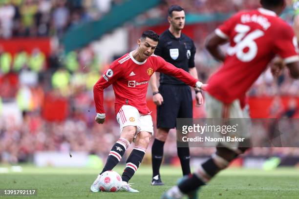 Cristiano Ronaldo of Manchester United scores their sides third goal and their hat-trick during the Premier League match between Manchester United...