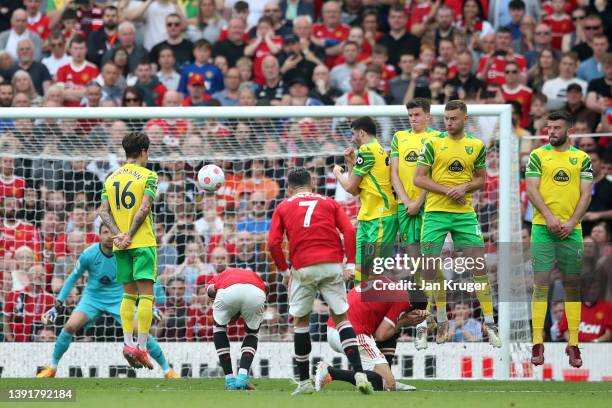 Cristiano Ronaldo of Manchester United scores their sides third goal and their hat-trick during the Premier League match between Manchester United...