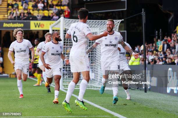 Pontus Jansson of Brentford celebrates with teammates after scoring their team's second goal during the Premier League match between Watford and...