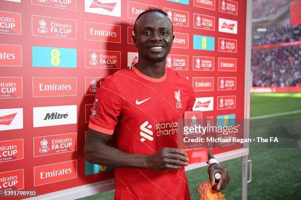 Sadio Mane of Liverpool poses with the player of the match award following victory in The Emirates FA Cup Semi-Final match between Manchester City...