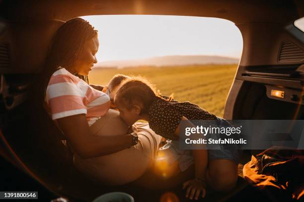 family is the most important thing in life - pregnant woman car stock pictures, royalty-free photos & images