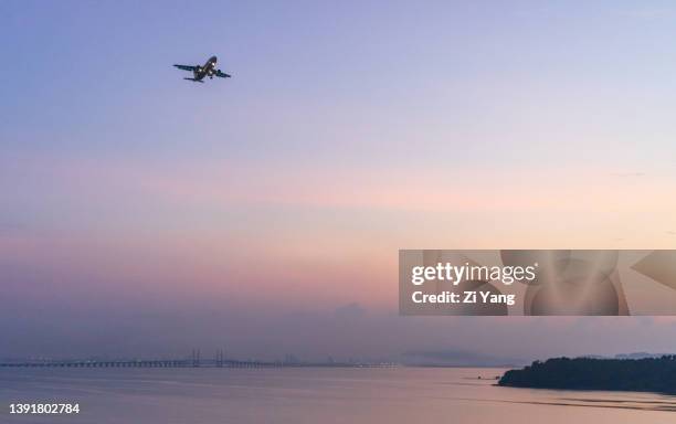 dhl (air hong kong) flight 391 (registration b-ldn) - final approach to penang international airport - dhl stock pictures, royalty-free photos & images