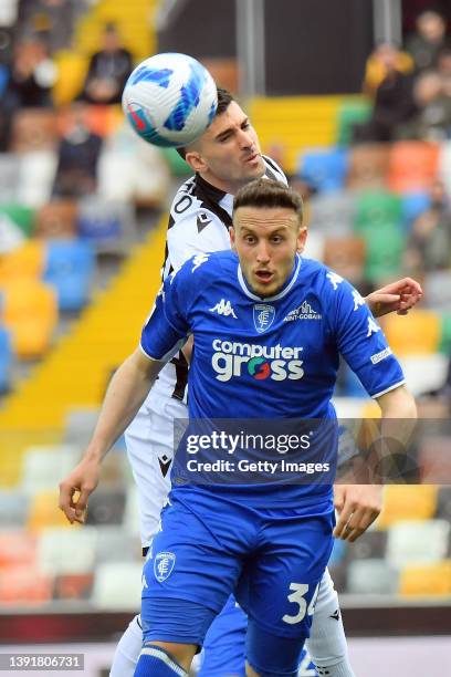 Ignacio Pussetto of Udinese Calcio competes for the ball with ArdianIsmajli of Empoli FC during the Serie A match between Udinese Calcio and Empoli...