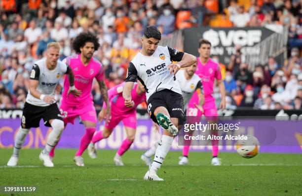 Carlos Soler of Valencia scores their side's first goal from a penalty during the LaLiga Santander match between Valencia CF and CA Osasuna at...