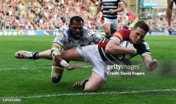 Freddie Steward of Leicester Tigers scores their fourth try despite being challenged by Alivereti Raka during the Heineken Champions Cup Round of 16...