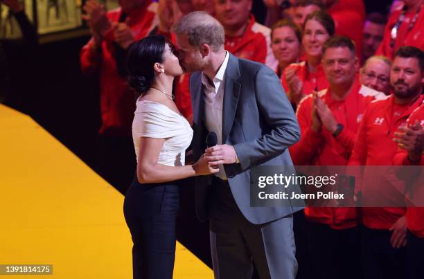 Meghan, Duchess of Sussex and Prince Harry, Duke of Sussex appear on stage during the Invictus Games The Hague 2020 Opening Ceremony at Zuiderpark on...