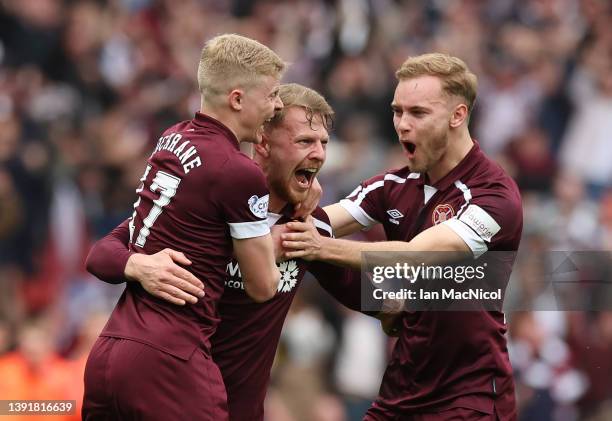 Stephen Kingsley of Heart of Midlothian celebrates with teammates Alex Cochrane and Nathaniel Atkinson after scoring their team's second goal during...