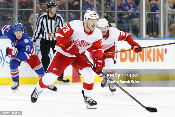 Adam Erne of the Detroit Red Wings controls the puck during the third period against the New York Rangers at Madison Square Garden on April 16, 2022...