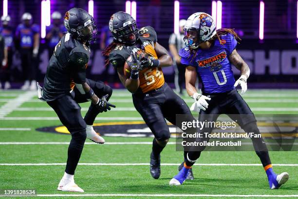 Jim Jones of Bored Apes FC intercepts a pass intended for Travalle Calvin of the Knights of Degan in the first half of the Fan Controlled Football...