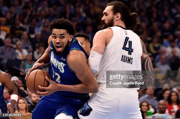 Karl-Anthony Towns of the Minnesota Timberwolves goes to the basket against Steven Adams of the Memphis Grizzlies during the first half of Game One...