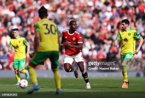 Paul Pogba of Manchester United runs with the ball during the Premier League match between Manchester United and Norwich City at Old Trafford on...