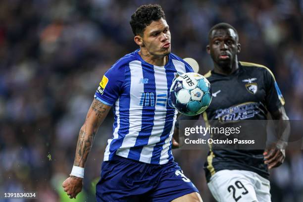 Evanilson of FC Porto and Julien Dacosta of Portimonense in action during the Liga Portugal Bwin match between FC Porto and Portimonense SC at...