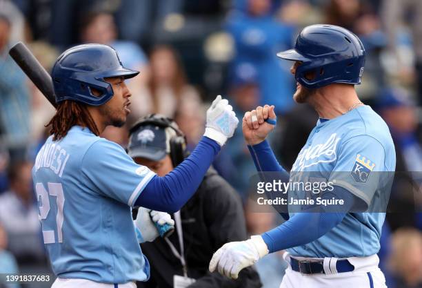 Hunter Dozier of the Kansas City Royals is congratulated by Adalberto Mondesi after hitting a 2-run home run during the 6th inning of the game...