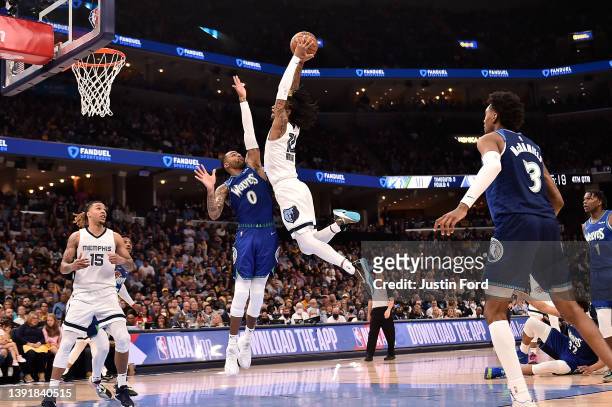 Ja Morant of the Memphis Grizzlies dunks against D'Angelo Russell of the Minnesota Timberwolves during the second half of Game One of the Western...