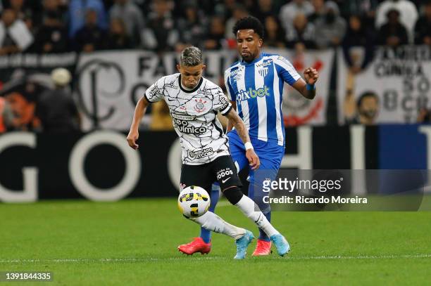 Adson of Corinthians and Cortez of Avaí compete for the ball during the match between Corinthians and Avaí as part of Brasileirao Series A 2022 at...
