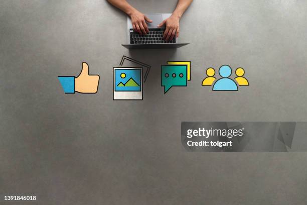 hand of businesswoman using laptop with icon social media and social network. online marketing concept - facebook post stock pictures, royalty-free photos & images