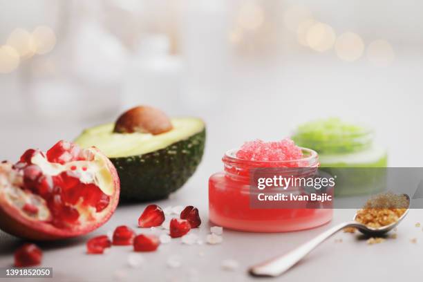 fruit body scrubs - clear skin red background stock pictures, royalty-free photos & images