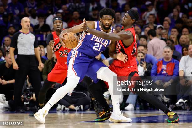 Joel Embiid of the Philadelphia 76ers is guarded by Pascal Siakam of the Toronto Raptors during the fourth quarter during Game One of the Eastern...