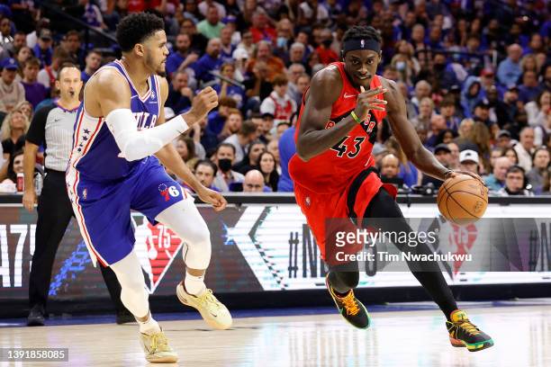 Pascal Siakam of the Toronto Raptors dribbles the ball past Tobias Harris of the Philadelphia 76ers during the third quarter during Game One of the...
