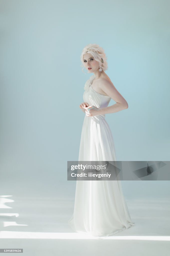 Young Blonde Model In Studio Woman With Beautiful Luxurious Greek Hairstyle In White Dress Girl With Butterfly On Hand Color Light Albino Beauty Portrait Greek Goddess Purity And Innocence High-Res Stock Photo - Young Blonde Model In Studio Woman With Beautiful Luxurious Greek Hairstyle In White Dress Girl With Butterfly On Hand Color Light Albino Beauty Portrait Greek Goddess Purity And Innocence High-Res Stock Photo -