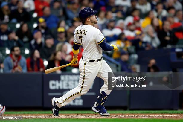 Victor Caratini of the Milwaukee Brewers hits a solo home run to left field in the eighth inning against the St. Louis Cardinals at American Family...