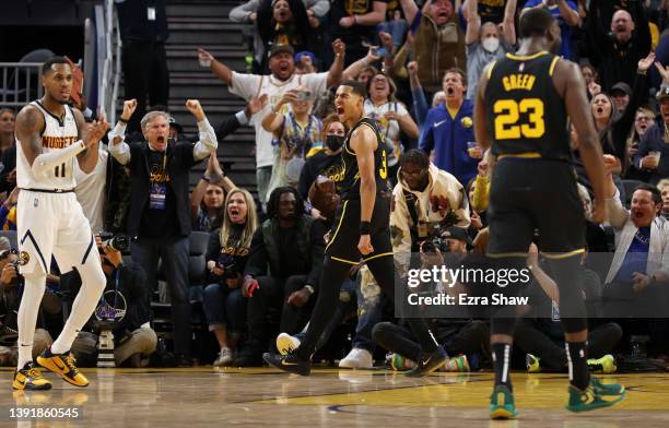 Jordan Poole of the Golden State Warriors reacts after he made a basket and was fouled by the Denver Nuggets in the first half during Game One of the...