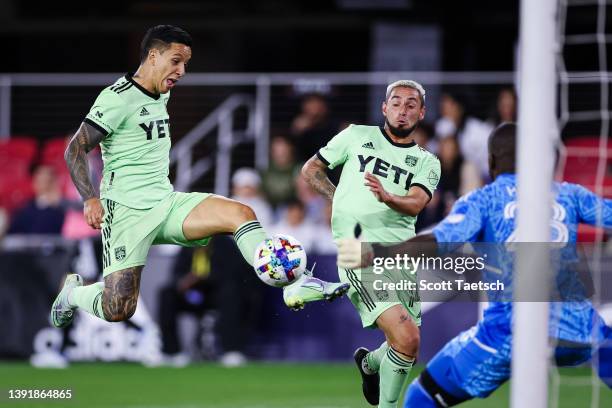 Sebastián Driussi of Austin FC leaps to score a goal against Bill Hamid of D.C. United during the second half of the MLS game at Audi Field on April...