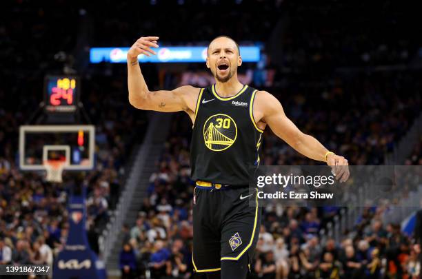 Stephen Curry of the Golden State Warriors gets the fired up against the Denver Nuggets in the second half during Game One of the Western Conference...