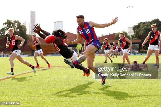 Lachie Modica of Port Melbourne kicks against Anthony Mcdonald-Tipungwuti of Essendon during the round four VFL match between Port Melbourne and the...